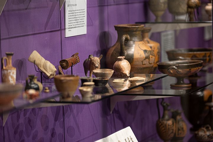 Display of pots and artefacts in the Archaeology Museum at the University of Birmingham