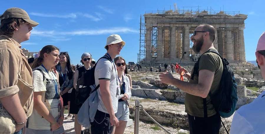 Dr Andrew Bayliss teaches students on the Athenian Acropolis during the 2022 study tour
