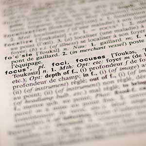 The definition of the word "focus" highlighted in a dictionary page.