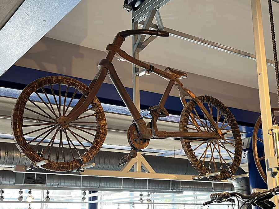 A wooden bicycle hanging from the ceiling in ThinkTank Birmingham Science Museum