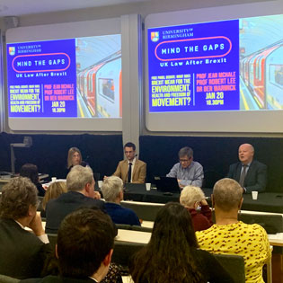 A photograph of the panel at the Mind The Gaps event at the University of Birmingham