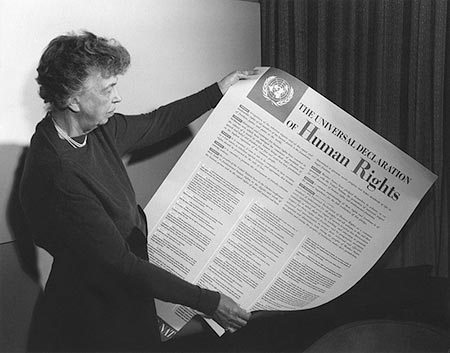 Eleanor Roosevelt holding poster of the Universal Declaration of Human Rights (in English), Lake Success, New York. November 1949