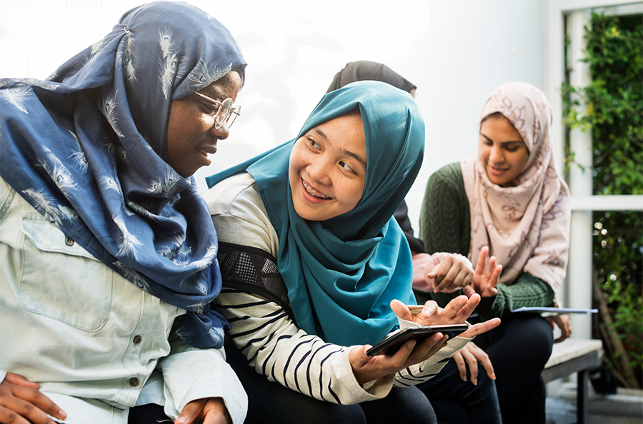 Group of students using mobile phones