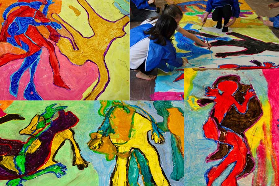 Children creating art at the body mapping workshop