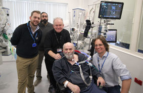 Professor Bob Stone (centre) with Intensive Care recovery patient, Nick Richards, and staff from Torbay and South Devon NHS Foundation Trust (TSDFT)