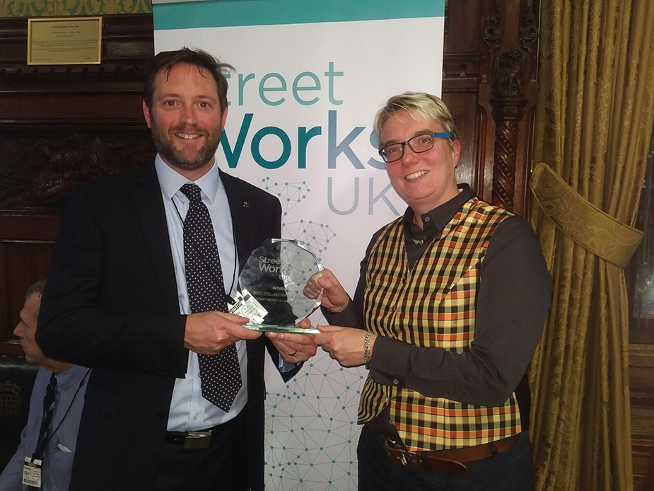 Professor George Tuckwell and Dr Nicole Mmetje holding their award at the Street Works Awards 2017 ceremony