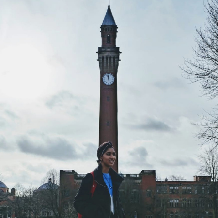 aerospace student in front of clock tower