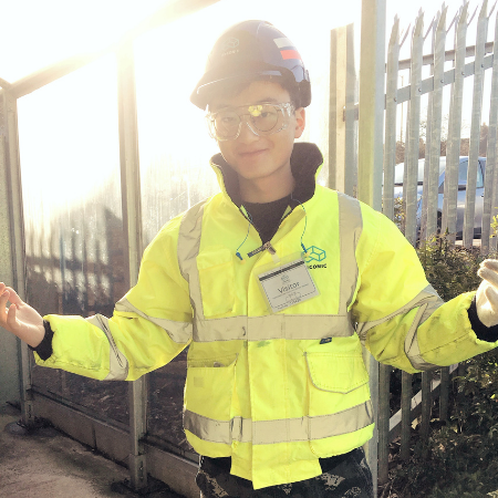 materials science student in high visibility jacket on site