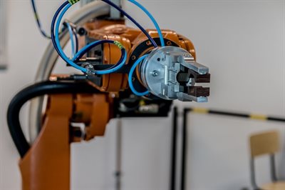 An orange industrial robotic-arm
