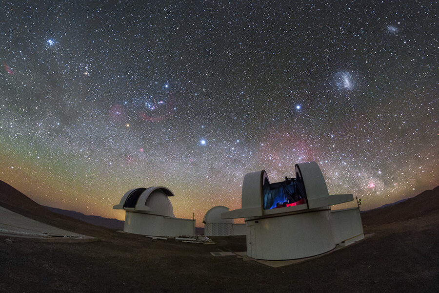 Image of the SPECULOOS telescopes and the night sky