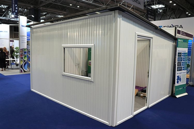 A white emergency shelter building made from recycled plastic