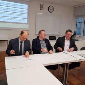 Dragoljub Rajic Director of Rail Cluster of South East Europe, Prof dr Tomislav Mlinaric, Dean of FTTS Zagreb and Alex Burrows, Director of BCRRE signing SEERRIN document. 