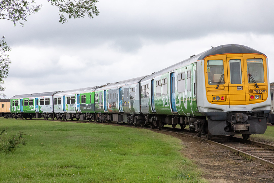 A hydrogen powered train travelling along a track