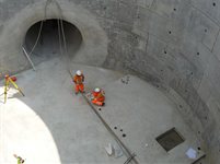 James Weston (pictured right), setting out foundations for a concrete staircase to go up the shaft that he is at the base of