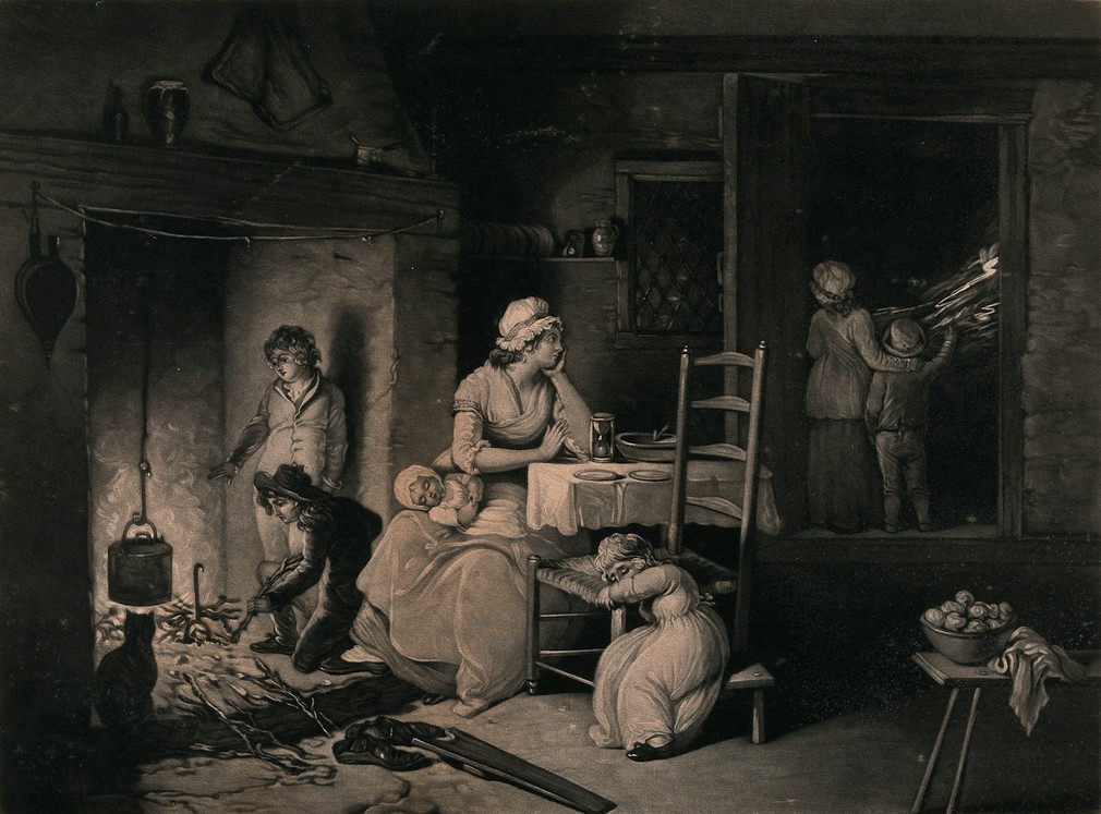 Woman at home in front of the fire with her family