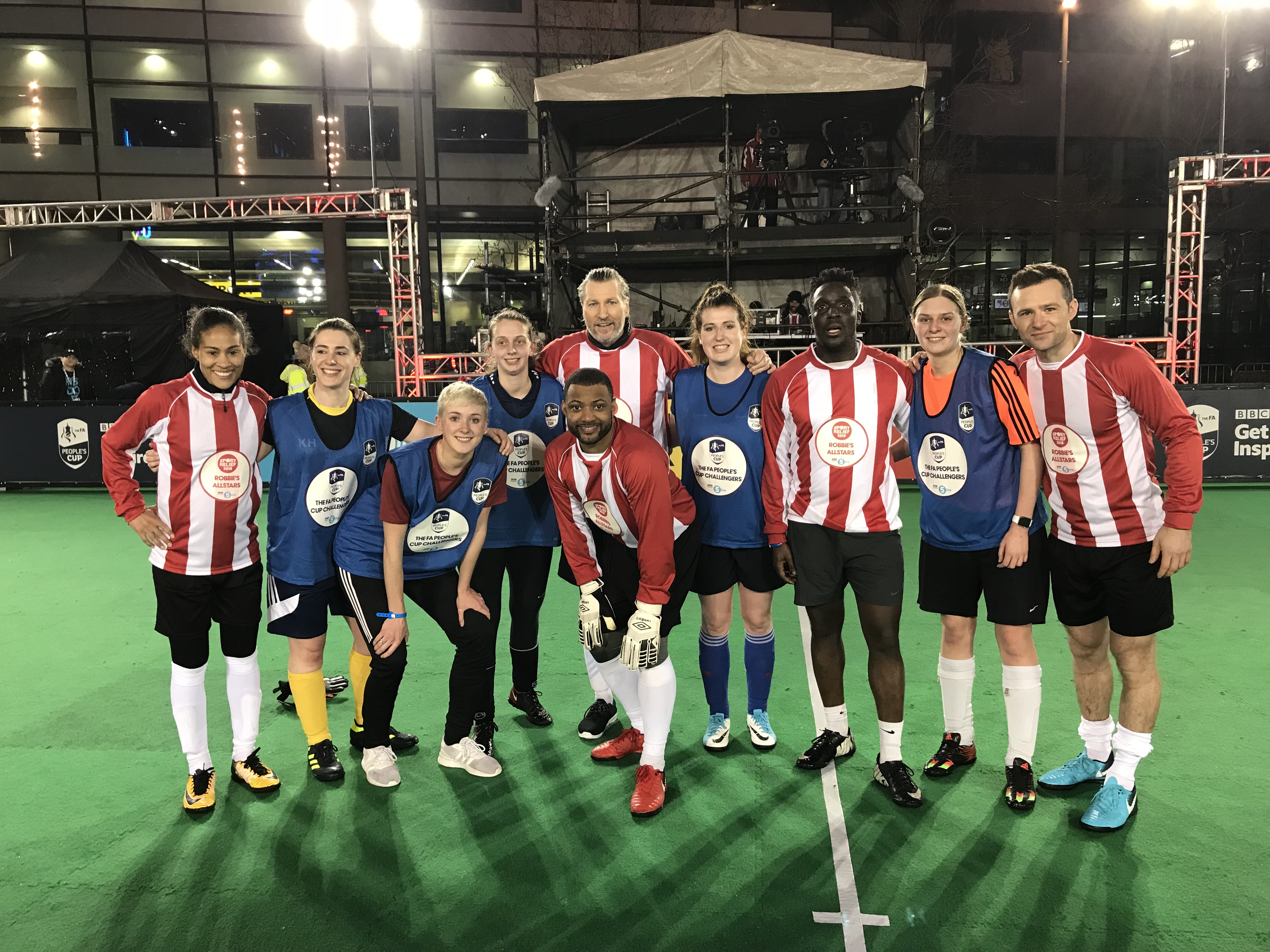 Members of Birmingham MedSoc Women’s Football Club and members of Robbie Savage's all-star celebrity team