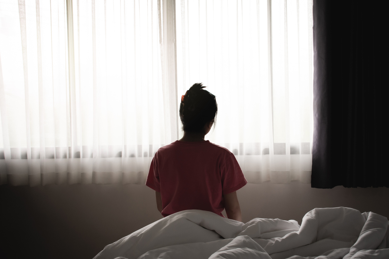 Sad-woman-on-bed