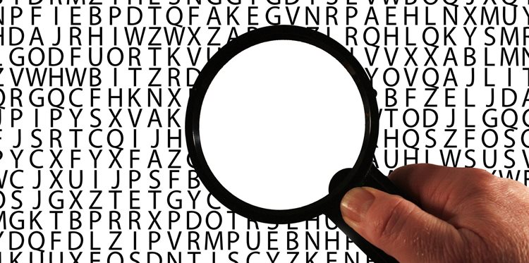 A magnifying glass held over an alphabet_1920x955