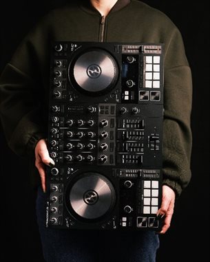 Academic holding a DJ deck