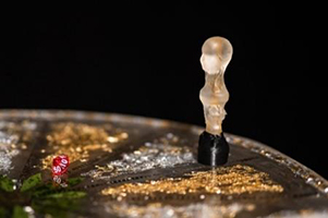 A close up of a glass figurine used in a game.