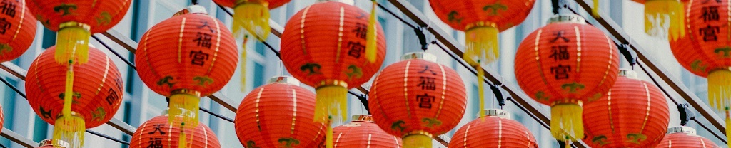 Lunar New Year orange Chinese lanterns hanging in the street