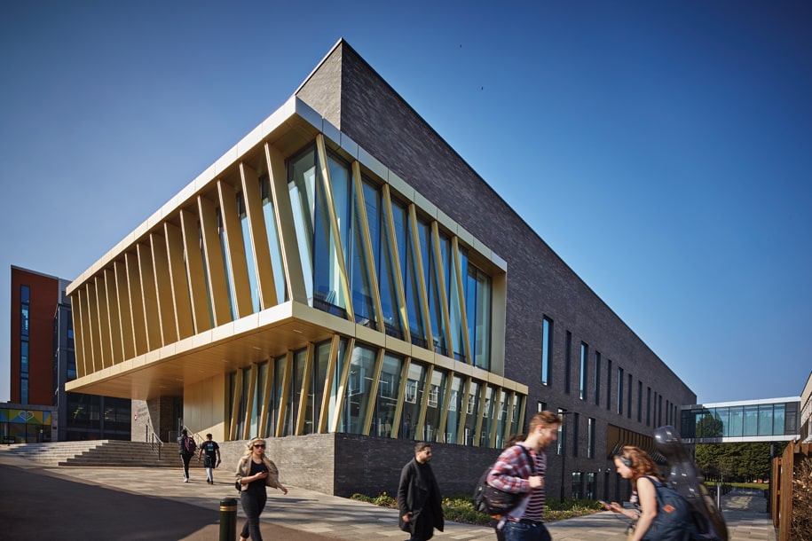 Exterior of the University of Birmingham's Collaborative Teaching Laboratory, with students walking by