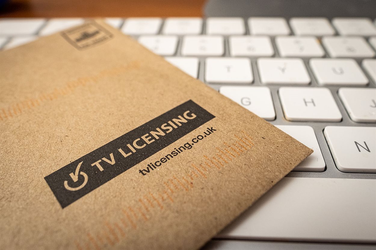 Tv licensing envelope sitting on a keyboard