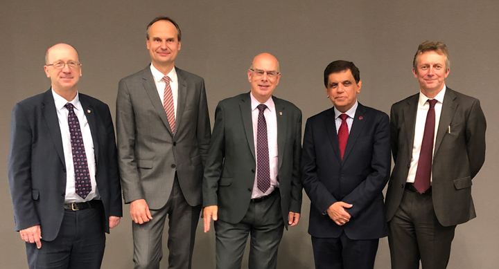 Professors Tim Softley, Paulus Kirchhof stand to the left of the VC Professor Sir David Eastwood, with Professor Sir Nilesh Samani to the right.