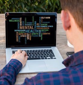 Boy looking at mental health information on screen