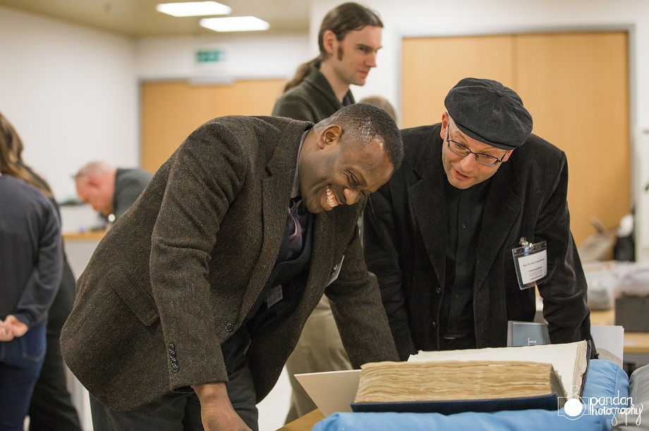 Dr Onyeka Nubia and the Rev. Dr Paul Edmondson examine items from the collection at the Everything to Everyone project launch.
