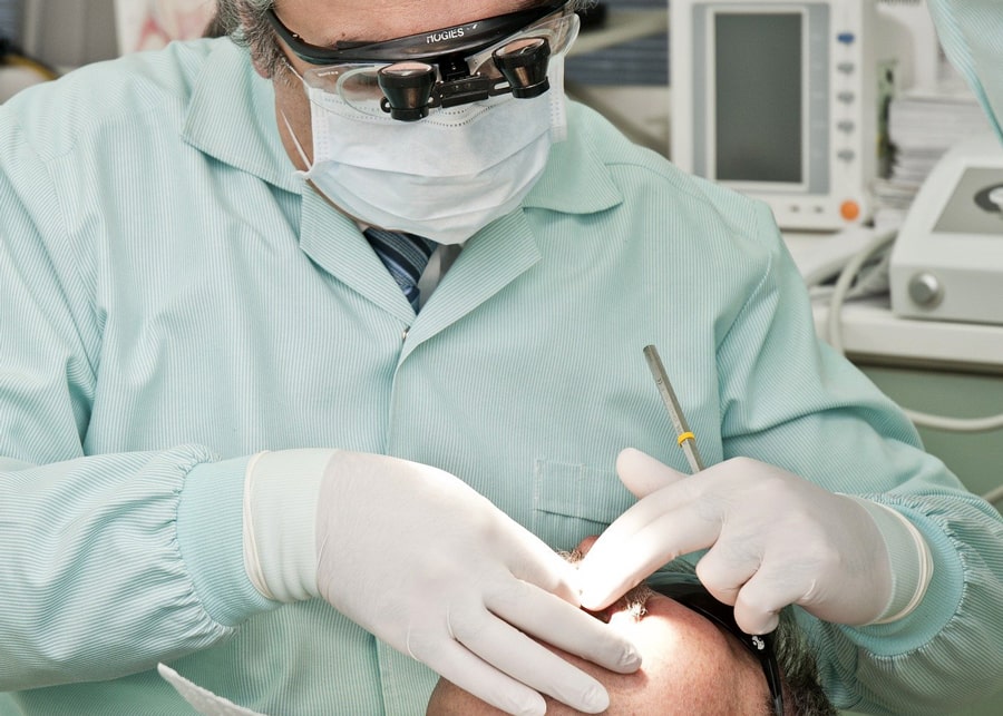 Dentist looking into patients mouth