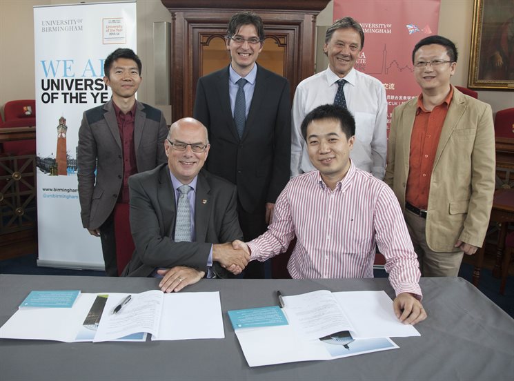 Professor Sir David Eastwood shakes hands with Professor Yong Zhang at the signing of a ground-breaking agreement between the University of Birmingham and BGI.