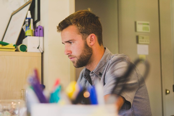 Pensive man sitting at a desk