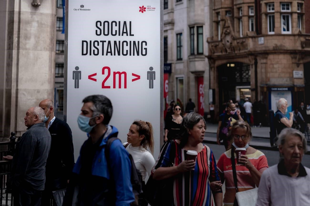 Social distancing awareness sign on Oxford Street, London