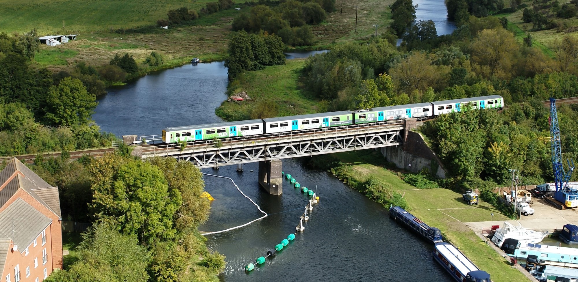 Drone shot of HydroFlex train on a bridge over a river