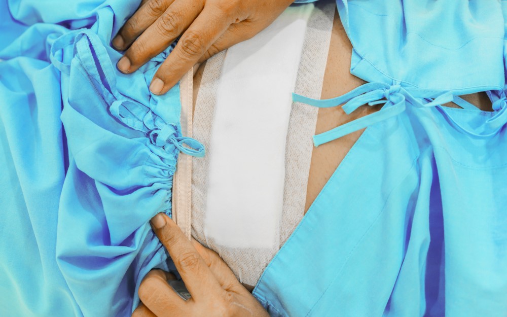 Close up of patient wearing waterproof bandages around the midsection