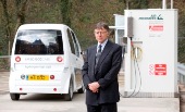 person standing next to a hydrogen fuel pump