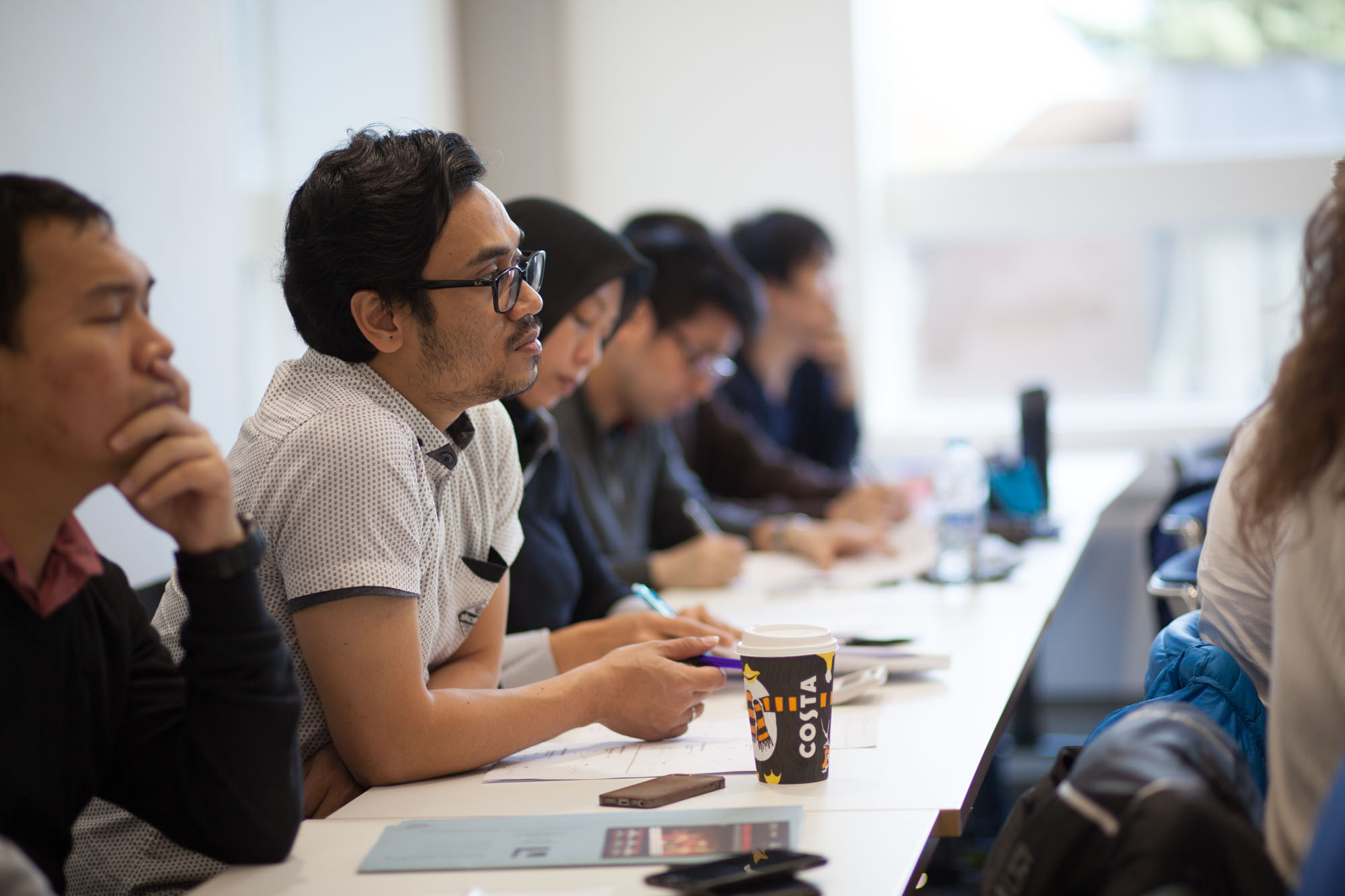 Students listening to a lecture in Alan Walters