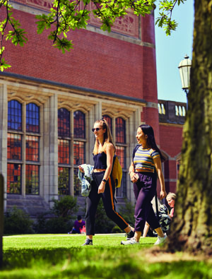 Students walking through campus on a sunny day