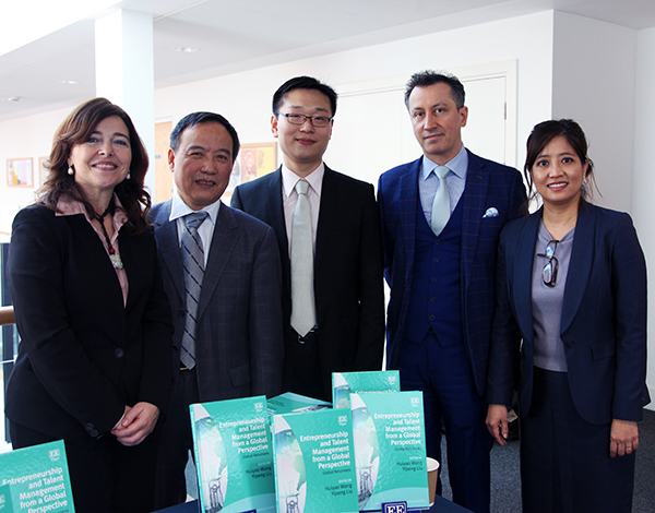 Yipeng with colleagues from the event