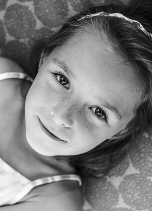 A black and white photo of a young Bulgarian girl