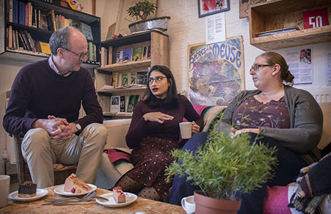 Two researchers having a discussion with a research participant