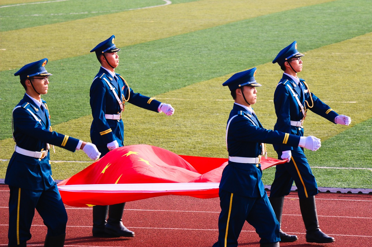 Chinese soldiers carrying the national flag