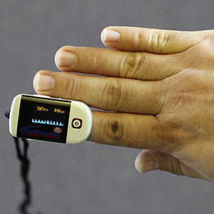 Man with Oximetry device on his finger