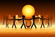drawing of group of people handing hands around a lightbulb
