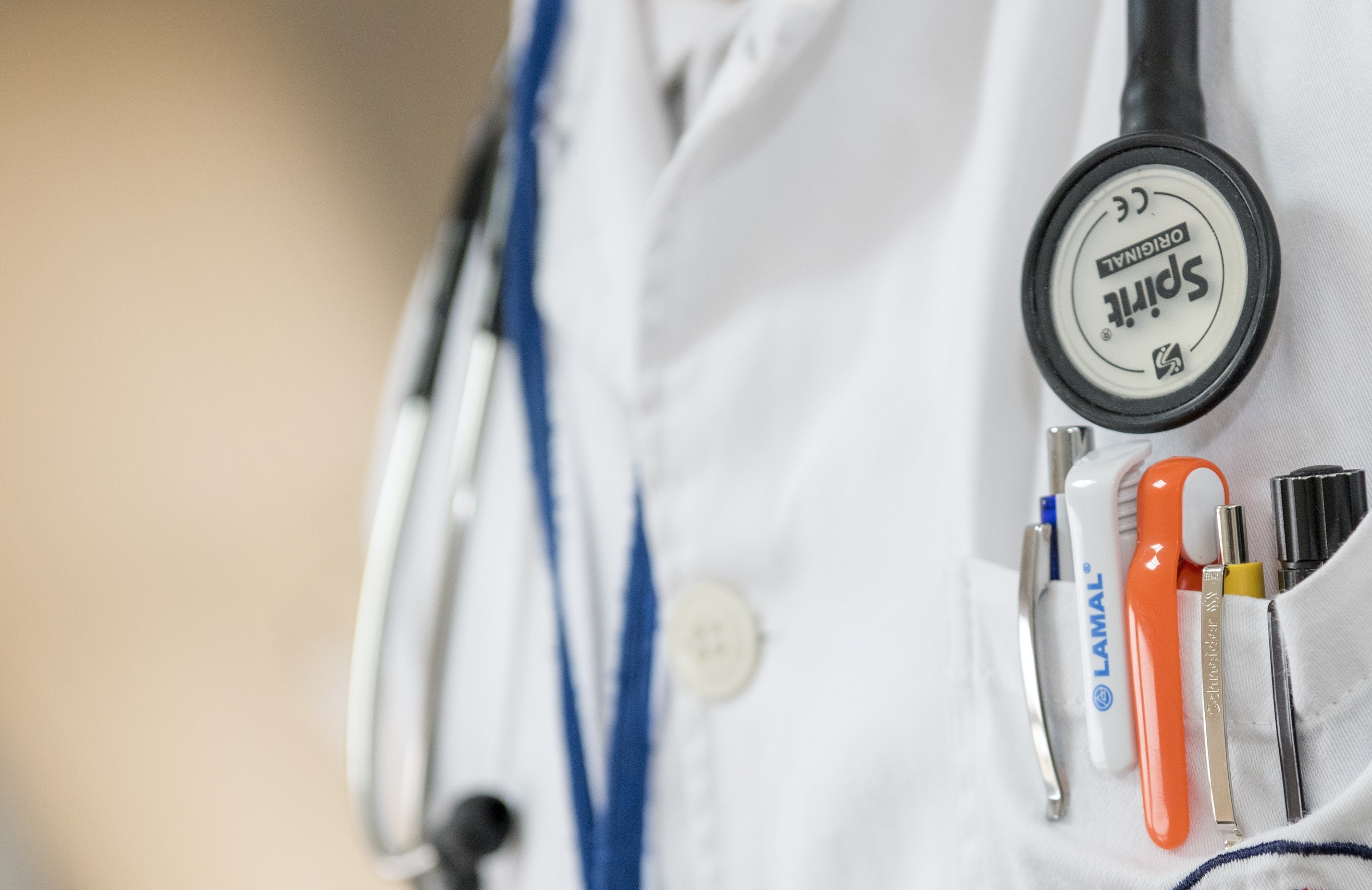 Close up of doctors uniform, pocket and stethoscope