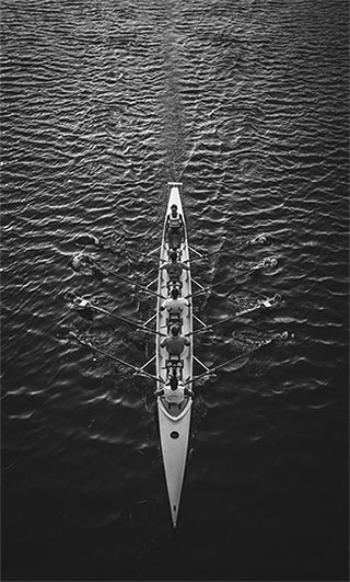 Five men in a rowing boat