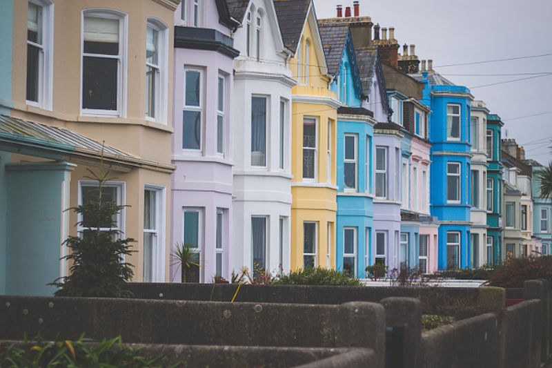 A row of brightly painted terraced houses