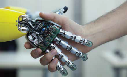 A robotic hand shaking a human hand