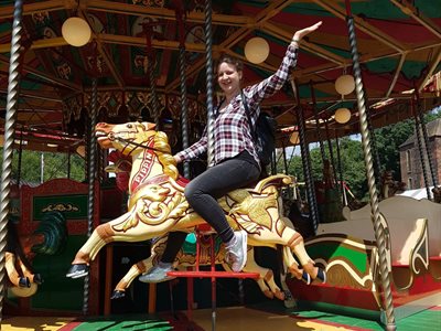 BISS student on a carousel horse